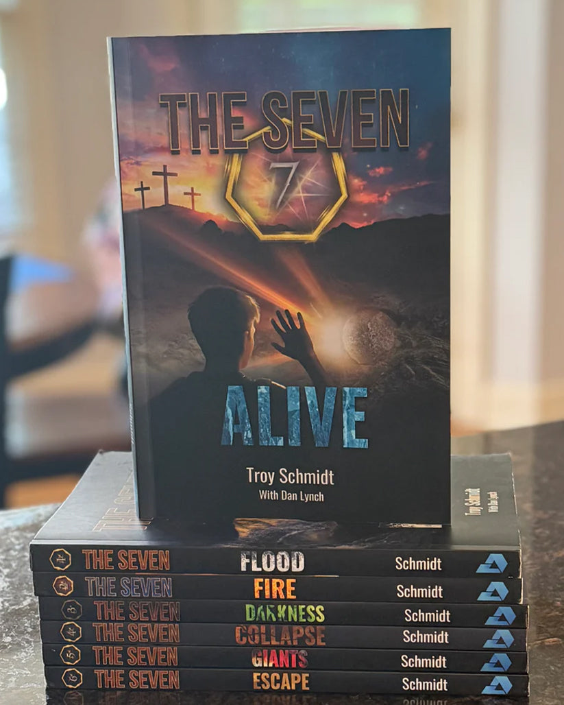 All seven books in THE SEVEN series stacked
